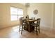 Cozy dining area featuring a stylish chandelier and comfortable seating for intimate meals at 4888 Sevilla Shores Dr, Wimauma, FL 33598