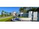The community entrance features manicured landscaping, a gatehouse, and a water fountain, creating a grand entrance at 4888 Sevilla Shores Dr, Wimauma, FL 33598