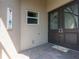 Front entry features double doors with decorative glass, and a “welcome” sign on the wall at 4888 Sevilla Shores Dr, Wimauma, FL 33598