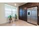 Bright kitchen area featuring ample cabinet space and stainless steel refrigerator at 4888 Sevilla Shores Dr, Wimauma, FL 33598