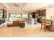 Open-concept living area seamlessly connects the kitchen, living, and dining spaces at 4888 Sevilla Shores Dr, Wimauma, FL 33598