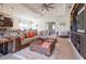 Inviting living room with modern furniture, decor, and open-concept layout to the kitchen at 4888 Sevilla Shores Dr, Wimauma, FL 33598
