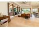 Inviting living room with stylish built-ins and a comfortable seating arrangement at 4888 Sevilla Shores Dr, Wimauma, FL 33598