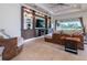 Spacious living room with custom built-ins, recessed lighting, and ample natural light at 4888 Sevilla Shores Dr, Wimauma, FL 33598