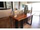 Close-up of a modern wood table showcasing the detail and unique design of the living space at 4888 Sevilla Shores Dr, Wimauma, FL 33598