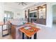 Bright living room featuring a media center, comfortable seating, and neutral decor at 4888 Sevilla Shores Dr, Wimauma, FL 33598