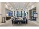 Elegant lounge area with coffered ceilings, refined decor, and community amenities at 4888 Sevilla Shores Dr, Wimauma, FL 33598