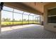 Large screened patio with brick pavers offering an ideal outdoor entertaining space at 4888 Sevilla Shores Dr, Wimauma, FL 33598