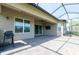 Spacious screened patio complete with brick pavers and outdoor grill, perfect for dining al fresco at 4888 Sevilla Shores Dr, Wimauma, FL 33598
