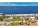 Beautiful aerial view of beachfront property with a sandy beach and calm, blue ocean at 4943 New England Blvd # 105, New Port Richey, FL 34652