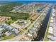 A beautiful waterfront community with access to canals and featuring a lush landscape in this aerial view at 4943 New England Blvd # 105, New Port Richey, FL 34652