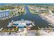Expansive aerial view of the marina with boat docks and waterway leading to the ocean at 4943 New England Blvd # 105, New Port Richey, FL 34652