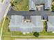 An aerial view of the property showing parking and a well-maintained landscape, offering convenience and curb appeal at 4943 New England Blvd # 105, New Port Richey, FL 34652