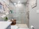 Bathroom with a glass enclosed shower with tiled surround at 4943 New England Blvd # 105, New Port Richey, FL 34652