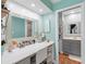 Vanity area with a large mirror and access to the full bathroom at 4943 New England Blvd # 105, New Port Richey, FL 34652