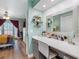 Vanity area between the bedroom and bathroom featuring a large mirror at 4943 New England Blvd # 105, New Port Richey, FL 34652