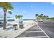 Beach scene featuring palm trees, sandy areas, grilling space, and beach access for outdoor enjoyment at 4943 New England Blvd # 105, New Port Richey, FL 34652