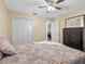 Second bedroom features a spacious closet and ceiling fan at 4943 New England Blvd # 105, New Port Richey, FL 34652