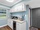 Cozy kitchen area featuring granite countertops, appliances, and a convenient entrance at 4943 New England Blvd # 105, New Port Richey, FL 34652