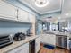Well-appointed kitchen with granite countertops, ample storage, and seamless flow into living area at 4943 New England Blvd # 105, New Port Richey, FL 34652