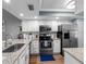 Well-equipped kitchen featuring stainless steel appliances and granite countertops at 4943 New England Blvd # 105, New Port Richey, FL 34652