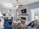 Open-concept living space with stylish furnishings, wood flooring, and bright decor at 4943 New England Blvd # 105, New Port Richey, FL 34652