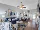 Open-concept living space with stylish furnishings, wood flooring, and bright decor at 4943 New England Blvd # 105, New Port Richey, FL 34652