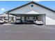 Convenient parking area with covered parking, landscaped features, and well-maintained asphalt at 4943 New England Blvd # 105, New Port Richey, FL 34652