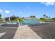 Community restroom facility with ample parking, paved walkway, and plenty of outdoor seating at 4943 New England Blvd # 105, New Port Richey, FL 34652