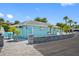 Community restroom facility with ample parking, paved walkway, and plenty of outdoor seating at 4943 New England Blvd # 105, New Port Richey, FL 34652