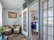 Cozy sun room featuring wicker furniture, bright light, and interior view at 4943 New England Blvd # 105, New Port Richey, FL 34652