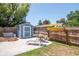 Backyard with shed, hot tub, surfboard rack, and patio seating provides a relaxing outdoor retreat at 513 W Paris St, Tampa, FL 33604