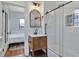 Updated bathroom featuring a glass shower enclosure, a vessel sink, and tile flooring at 513 W Paris St, Tampa, FL 33604