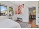 Bright bedroom featuring hardwood floors, large windows, and colorful modern art at 513 W Paris St, Tampa, FL 33604