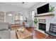 Cozy living room with brick fireplace, wood floors, and comfortable seating at 513 W Paris St, Tampa, FL 33604