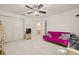 Bedroom featuring carpeted floors and large closet space at 5434 Wellfield Rd, New Port Richey, FL 34655