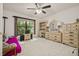 Bedroom with large window, ceiling fan, and furniture at 5434 Wellfield Rd, New Port Richey, FL 34655