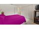 Bedroom featuring carpeted floors and large closet for storage at 5434 Wellfield Rd, New Port Richey, FL 34655