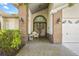 Welcoming front porch with decorative brickwork, charming entry, and a cozy seating area at 5434 Wellfield Rd, New Port Richey, FL 34655