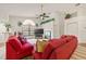 Spacious living area with vaulted ceilings, large windows, and a comfortable seating arrangement at 5434 Wellfield Rd, New Port Richey, FL 34655
