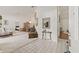 Bright living area with white walls, plush carpeting, and an open layout to the dining area at 5434 Wellfield Rd, New Port Richey, FL 34655
