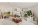 Open concept living and dining area with a large arched window and neutral color palette throughout at 5434 Wellfield Rd, New Port Richey, FL 34655