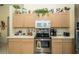 Functional kitchen featuring ample cabinet space, stainless steel appliances, and plenty of counter space at 5465 Chestnut Ridge Rd, Dade City, FL 33523