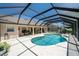 Backyard features a screened-in pool, offering a private oasis for relaxation and outdoor entertainment at 5465 Chestnut Ridge Rd, Dade City, FL 33523