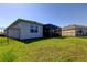 Fenced backyard with a screened-in patio, offering privacy and outdoor enjoyment at 5920 Silver Palm Blvd, Bradenton, FL 34211