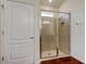 Bathroom featuring a glass shower with a small window providing natural light and an easy-to-clean tiled floor at 5920 Silver Palm Blvd, Bradenton, FL 34211
