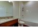 Bathroom features a granite countertop vanity, tile flooring, and a shower-tub combo at 5920 Silver Palm Blvd, Bradenton, FL 34211