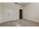 Neutral bedroom with carpet, white walls, and double door closet with bright white trim at 5920 Silver Palm Blvd, Bradenton, FL 34211