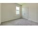 Bedroom with carpet flooring, closet, and bright window at 5920 Silver Palm Blvd, Bradenton, FL 34211