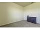 Neutral bedroom offers carpet and white walls, with a dresser for storage at 5920 Silver Palm Blvd, Bradenton, FL 34211
